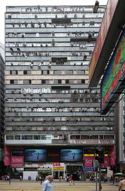 Front elevation of an 17 storey tenement building with street-level retail access