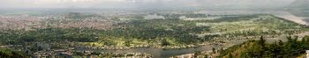 Panorama of city in green area near a river and lakes